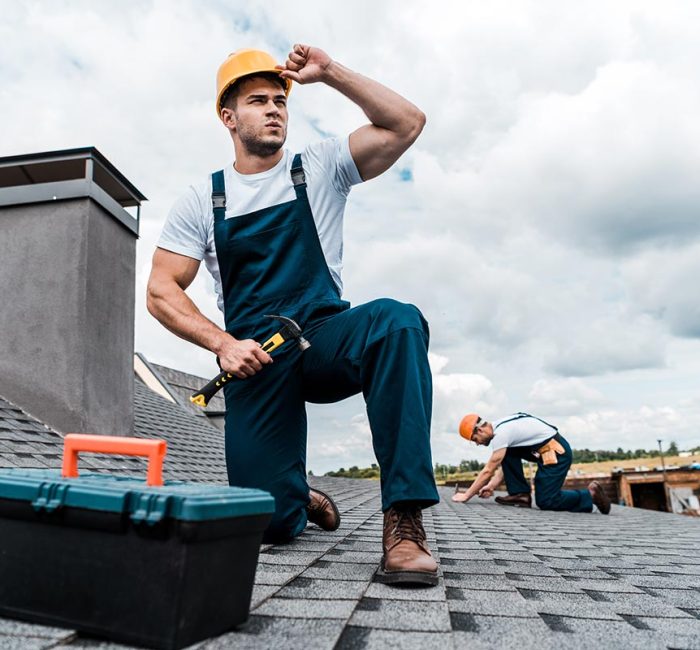 selective-focus-of-handsome-handyman-touching-helm-resize.jpg